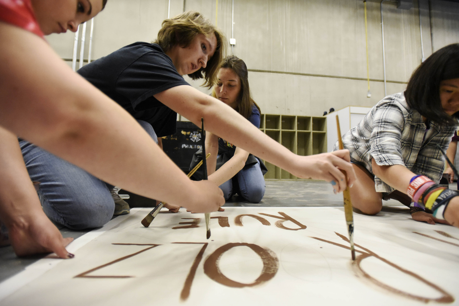 Students in the Broadway Camp: Production crew paint signs for Pippin backstage at Proctors Wednesday, July 12, 2017.