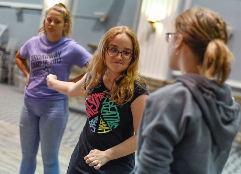 Broadway Jr. campers learn fight choreography like stage slaps and punches that look and sound real at Proctors Tuesday, July 11, 2017.