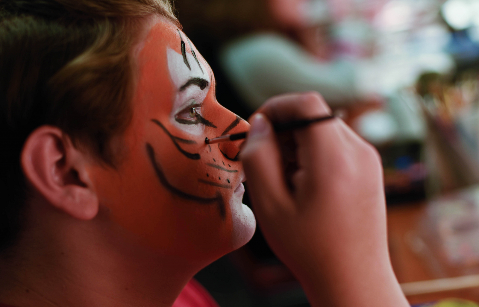 Students paint their faces in Stage and Special FX Makeup camp at Proctors Wednesday, July 19, 2017.